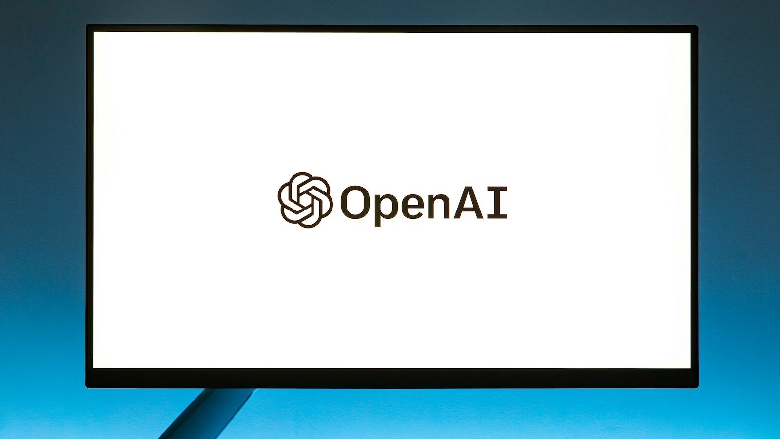 a computer screen with the open ai logo on it